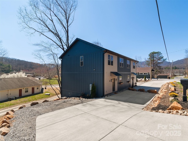 282 County Rd, Waynesville, NC 28785 - exterior space with board and batten siding and a mountain view