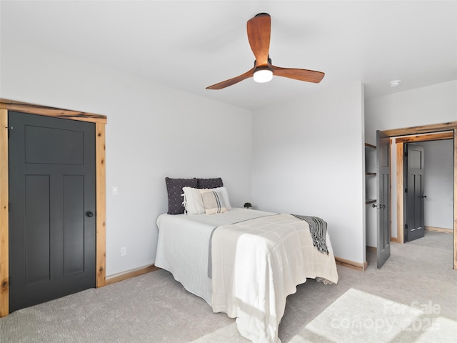 282 County Rd, Waynesville, NC 28785 - bedroom with baseboards, ceiling fan, and light carpet