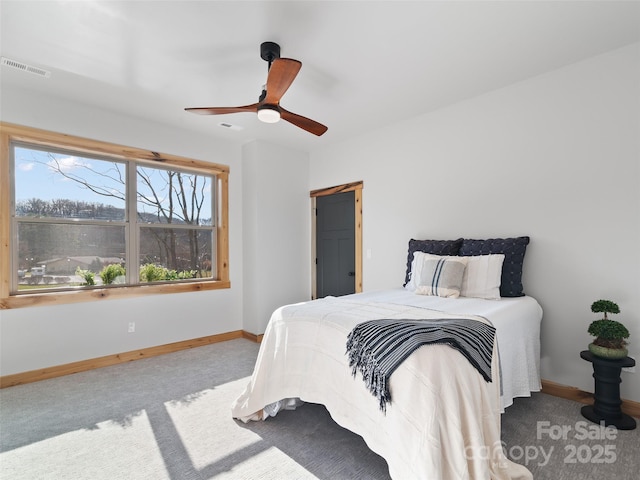 282 County Rd, Waynesville, NC 28785 - carpeted bedroom with visible vents, baseboards, and ceiling fan