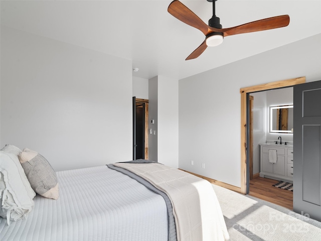 282 County Rd, Waynesville, NC 28785 - bedroom with light wood-style flooring, a ceiling fan, and baseboards
