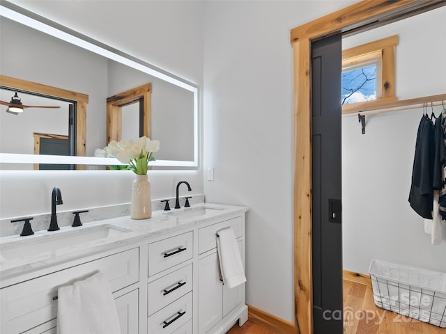 282 County Rd, Waynesville, NC 28785 - bathroom with a sink, double vanity, and wood finished floors