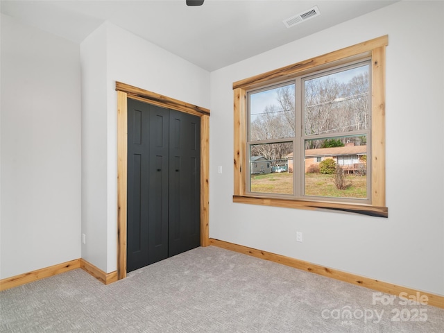 282 County Rd, Waynesville, NC 28785 - unfurnished bedroom featuring visible vents, baseboards, and carpet flooring