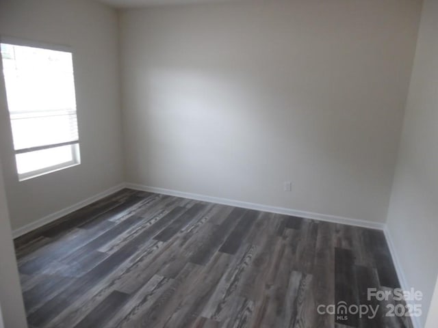 574 30th Avenue Cir NE, Hickory, NC 28601 - spare room featuring baseboards and dark wood finished floors