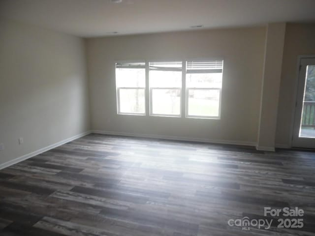 574 30th Avenue Cir NE, Hickory, NC 28601 - spare room with dark wood-type flooring and baseboards
