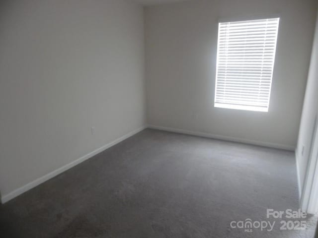 574 30th Avenue Cir NE, Hickory, NC 28601 - carpeted empty room with baseboards and a wealth of natural light