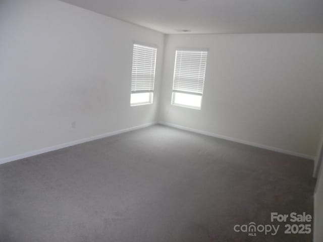 574 30th Avenue Cir NE, Hickory, NC 28601 - carpeted spare room featuring baseboards