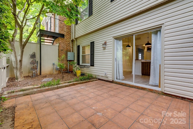 view of patio featuring fence