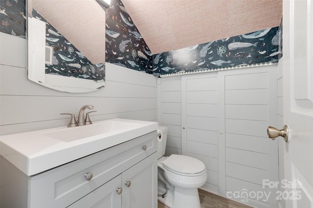 5901 Quail Hollow Rd Unit G, Charlotte, NC 28210 - half bathroom featuring wallpapered walls, vanity, toilet, and wood finished floors