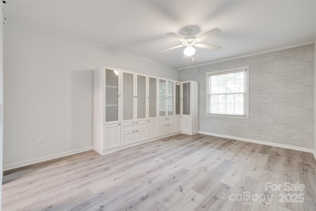 5901 Quail Hollow Rd Unit G, Charlotte, NC 28210 - spare room featuring light wood-style flooring, baseboards, and a ceiling fan