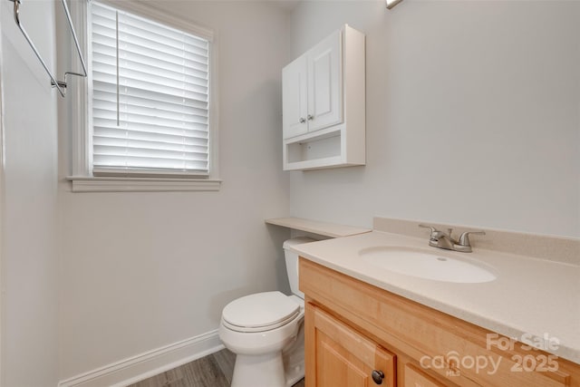 5901 Quail Hollow Rd Unit G, Charlotte, NC 28210 - bathroom with vanity, toilet, baseboards, and wood finished floors
