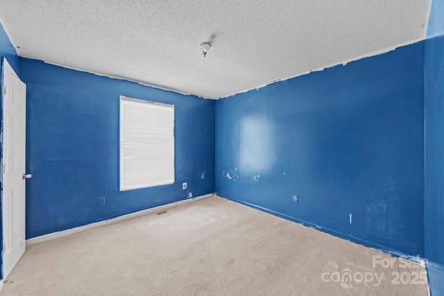 809 1st St E, Ahoskie, NC 27910 - carpeted spare room featuring a textured ceiling and baseboards