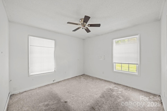 809 1st St E, Ahoskie, NC 27910 - unfurnished room with carpet flooring, a textured ceiling, ceiling fan, and baseboards