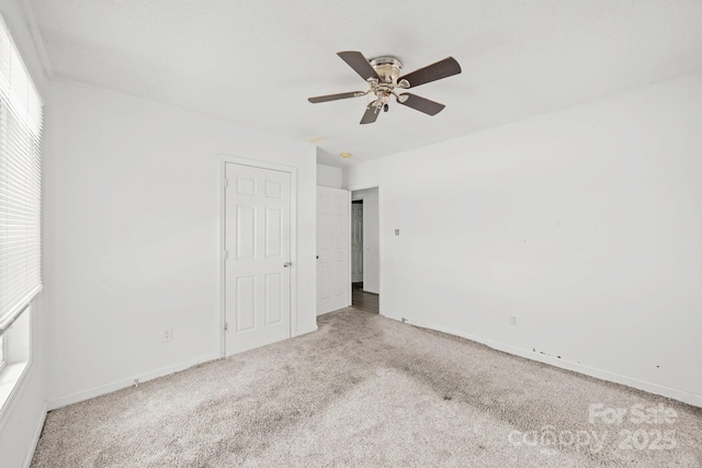 809 1st St E, Ahoskie, NC 27910 - unfurnished bedroom with carpet, baseboards, and a ceiling fan