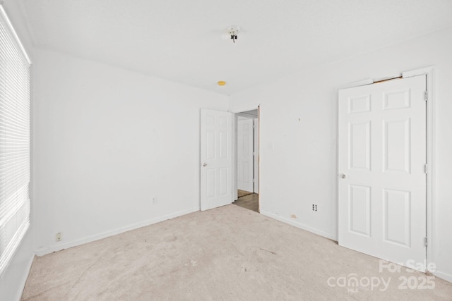 809 1st St E, Ahoskie, NC 27910 - unfurnished bedroom with carpet and baseboards