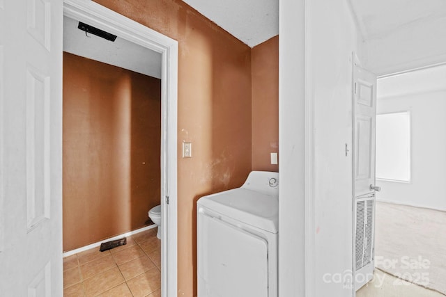 809 1st St E, Ahoskie, NC 27910 - laundry area with washer / dryer and light tile patterned floors