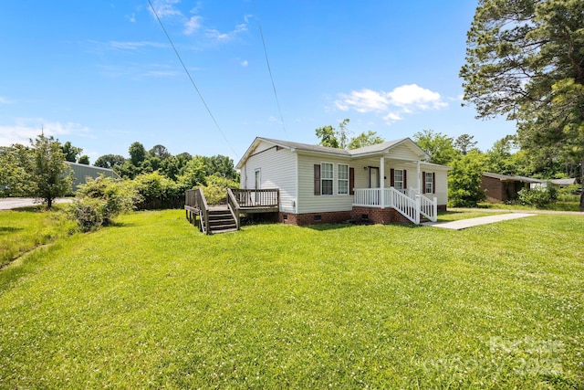 809 1st St E, Ahoskie, NC 27910 - view of front of home with crawl space, a front lawn, and a deck