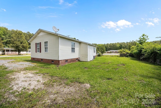 809 1st St E, Ahoskie, NC 27910 - view of side of home featuring crawl space and a lawn