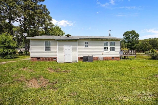 809 1st St E, Ahoskie, NC 27910 - rear view of property featuring crawl space, central AC unit, a lawn, and a wooden deck