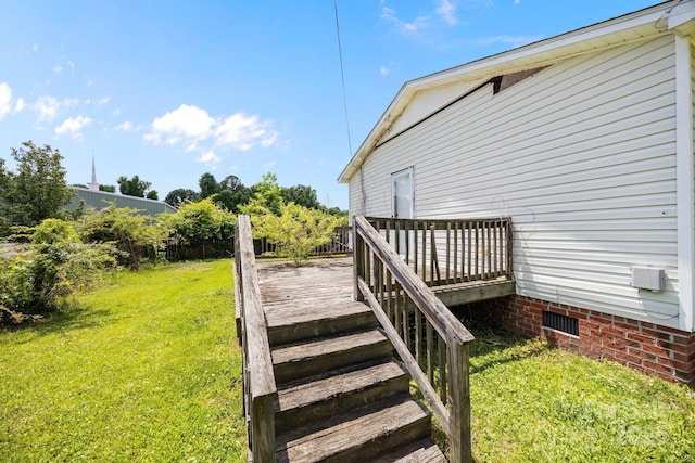 809 1st St E, Ahoskie, NC 27910 - wooden deck featuring a lawn