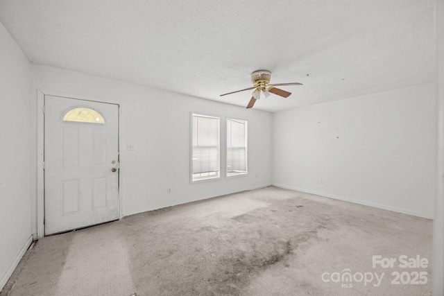 809 1st St E, Ahoskie, NC 27910 - unfurnished room with ceiling fan, carpet, and baseboards
