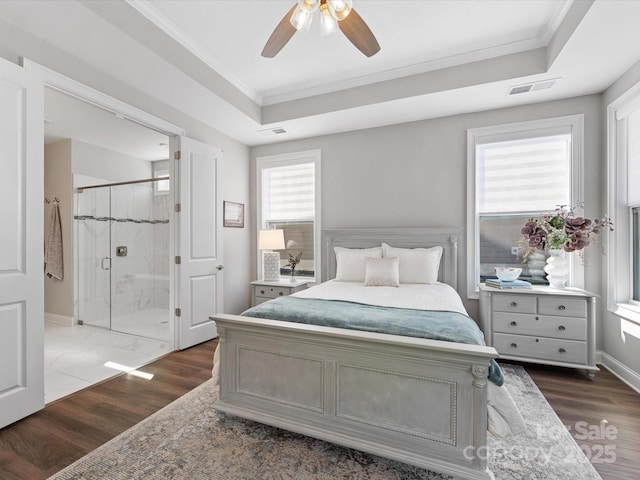 bedroom featuring visible vents, ornamental molding, and dark wood finished floors