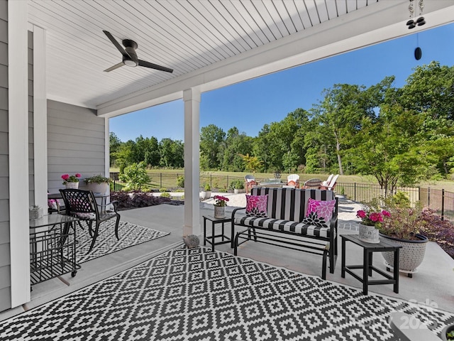 view of patio / terrace featuring a fenced backyard, an outdoor hangout area, and ceiling fan