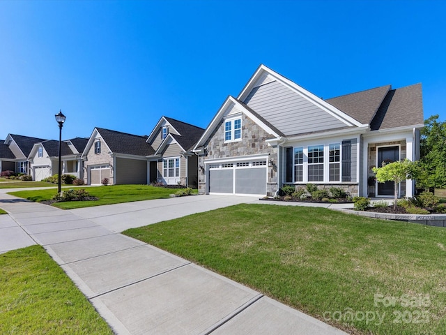 craftsman inspired home featuring a front yard, driveway, stone siding, and a garage
