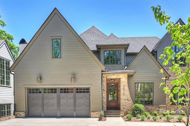 3473 Willow Oak Rd, Charlotte, NC 28209 - craftsman house featuring an attached garage, driveway, and brick siding