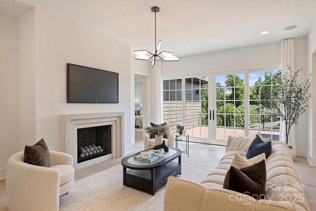 3473 Willow Oak Rd, Charlotte, NC 28209 - living area featuring recessed lighting, light wood finished floors, and a chandelier