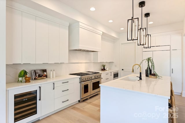 3473 Willow Oak Rd, Charlotte, NC 28209 - kitchen with a sink, range with two ovens, decorative backsplash, wine cooler, and custom exhaust hood