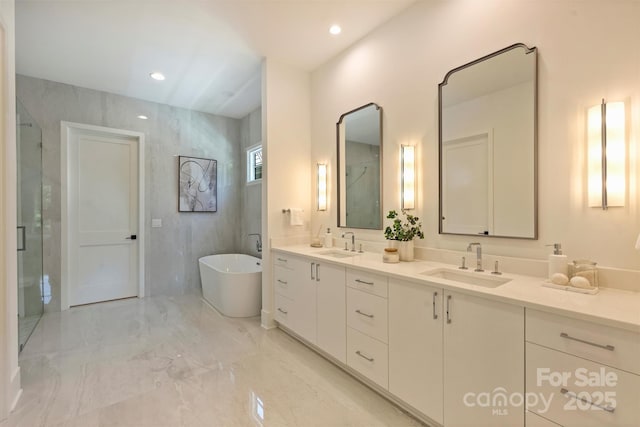3473 Willow Oak Rd, Charlotte, NC 28209 - full bath featuring a sink, a freestanding tub, double vanity, and marble finish floor