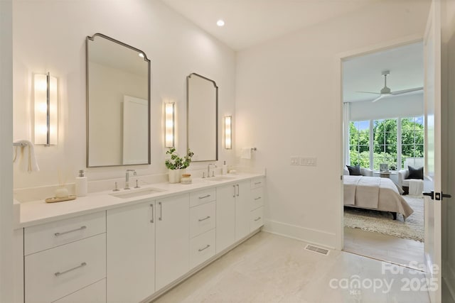 3473 Willow Oak Rd, Charlotte, NC 28209 - full bath with double vanity, baseboards, visible vents, and a sink