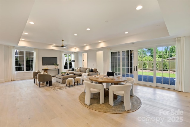 3473 Willow Oak Rd, Charlotte, NC 28209 - dining room with a healthy amount of sunlight, light wood finished floors, and a raised ceiling