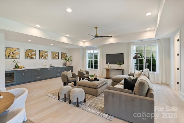 3473 Willow Oak Rd, Charlotte, NC 28209 - living area featuring light wood-style floors, recessed lighting, wet bar, and ceiling fan