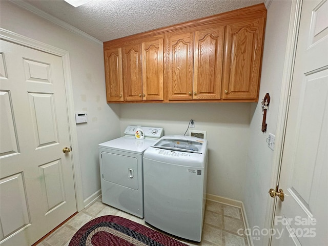 904 3rd Street Pl NE, Conover, NC 28613 - laundry room with baseboards, a textured ceiling, cabinet space, and independent washer and dryer