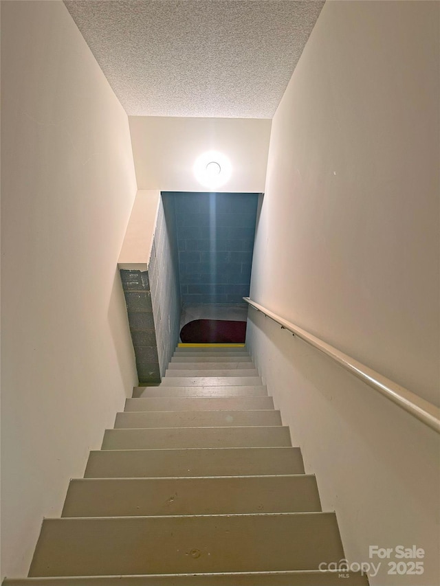 904 3rd Street Pl NE, Conover, NC 28613 - stairs with a textured ceiling