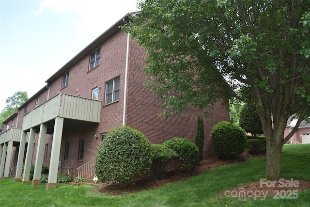 904 3rd Street Pl NE, Conover, NC 28613 - view of side of home featuring brick siding and a lawn
