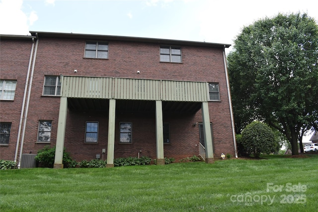 904 3rd Street Pl NE, Conover, NC 28613 - back of property featuring brick siding, central AC, and a yard
