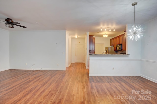 unfurnished living room with a ceiling fan, baseboards, light wood-style floors, and ornamental molding