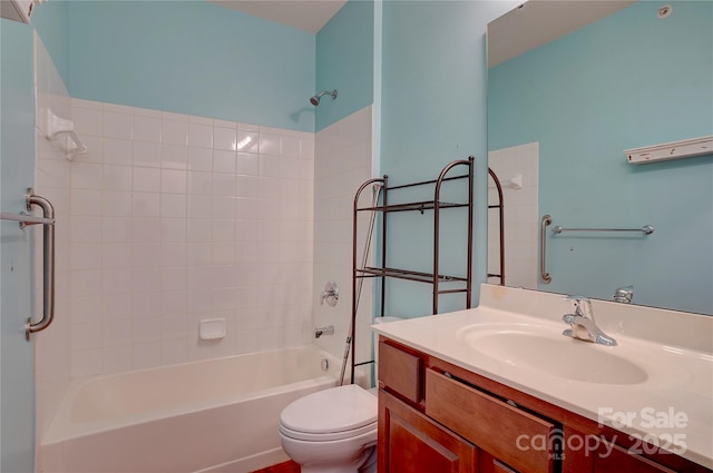 bathroom with shower / washtub combination, vanity, and toilet