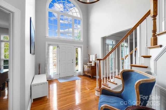 16532 Flintrock Falls Ln, Charlotte, NC 28278 - foyer featuring hardwood / wood-style floors, a healthy amount of sunlight, stairway, and a high ceiling