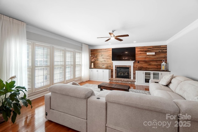 16532 Flintrock Falls Ln, Charlotte, NC 28278 - living room featuring light wood-type flooring, crown molding, ceiling fan, and wood walls
