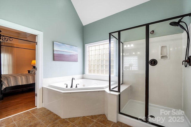 16532 Flintrock Falls Ln, Charlotte, NC 28278 - ensuite bathroom with tile patterned floors, vaulted ceiling, a whirlpool tub, a shower stall, and connected bathroom