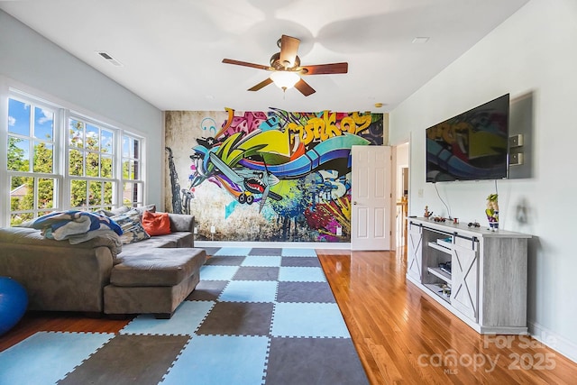 16532 Flintrock Falls Ln, Charlotte, NC 28278 - living room featuring wood finished floors, visible vents, a ceiling fan, and baseboards