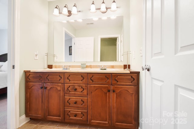 16532 Flintrock Falls Ln, Charlotte, NC 28278 - full bathroom with double vanity, visible vents, a sink, and connected bathroom