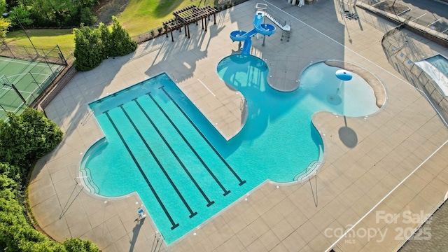 16532 Flintrock Falls Ln, Charlotte, NC 28278 - community pool with a water play area, a patio area, a water slide, and fence