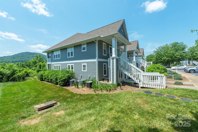 3101 Idle Hour Dr, Asheville, NC 28806 - view of side of property featuring a yard, stairway, and a shingled roof