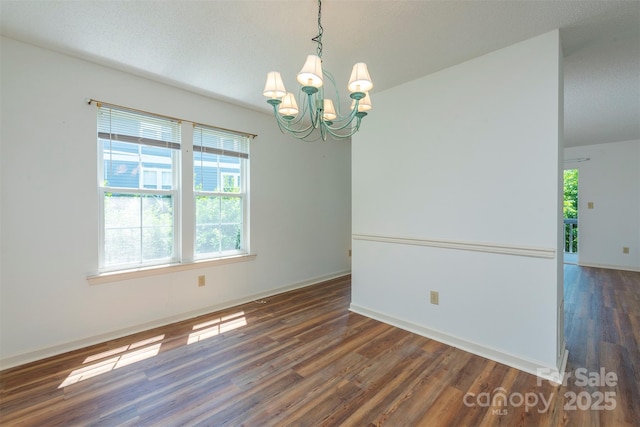 3101 Idle Hour Dr, Asheville, NC 28806 - empty room with a chandelier and wood finished floors
