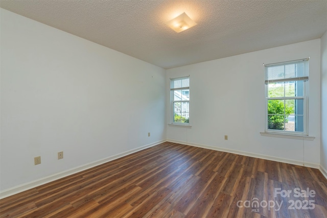 3101 Idle Hour Dr, Asheville, NC 28806 - spare room featuring healthy amount of natural light and dark wood finished floors