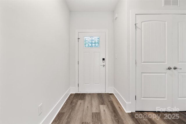 508 Clegg St, Shelby, NC 28150 - doorway with visible vents, dark wood-style flooring, and baseboards